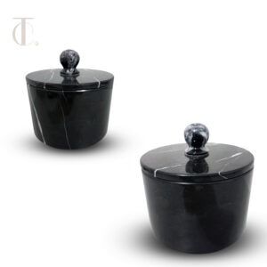 This marble canister with lid is meticulously carved from authentic natural stone