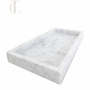 Handcrafted rectangular natural stone amenity tray in light marble for luxury hotel rooms